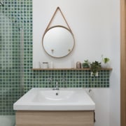 Green tiles from the shower run along the bathroom, bathroom accessory, bathroom cabinet, home, interior design, plumbing fixture, product design, room, sink, tap, gray