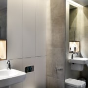 The bathroom features recessed lighting – like the bathroom, bathroom accessory, bathroom cabinet, bidet, floor, interior design, plumbing fixture, product design, sink, tap, toilet, toilet seat, wall, gray