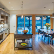 Sitting at the dining table, you have views countertop, dining room, interior design, kitchen, real estate, room, gray