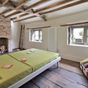 Wood beams run across the ceiling in this ceiling, estate, interior design, property, real estate, room, gray