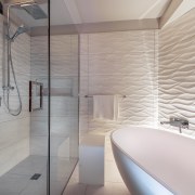 Distinctive 3D wave-pattern tiles running behind the tub architecture, bathroom, ceiling, floor, flooring, interior design, room, tile, wall, gray