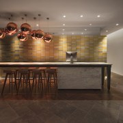 Architect: concrete ceiling, countertop, floor, flooring, furniture, hardwood, interior design, laminate flooring, lighting, lobby, table, tile, wall, wood, wood flooring, black, gray