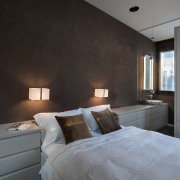 A unique headboard features shelf space and drawers architecture, bedroom, ceiling, floor, home, interior design, property, real estate, room, wall, gray, black