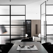 A view from the dining area into the black and white, furniture, interior design, product design, white