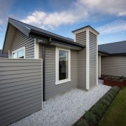 Running the fence in line with the house building, cottage, elevation, estate, facade, home, house, property, real estate, residential area, roof, siding, window, gray