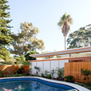 Architect: Day Bukh ArchitectsPhotography by Katherine Lu arecales, backyard, estate, home, house, landscaping, leisure, outdoor structure, palm tree, property, real estate, resort, swimming pool, tree, villa, white