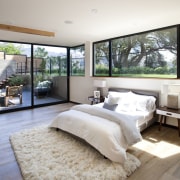 A sunken bedroom with views out to the bed frame, bedroom, ceiling, floor, home, interior design, mattress, wall, window, wood, gray