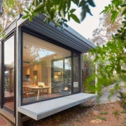 The dining room is just step away from architecture, backyard, home, house, property, real estate, roof, window, brown