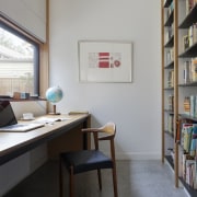 This cozy study area features a large window furniture, interior design, office, shelving, gray