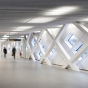 This hallway certainly echoes the airport terminal aesthetic architecture, ceiling, daylighting, floor, interior design, product design, structure, tourist attraction, gray