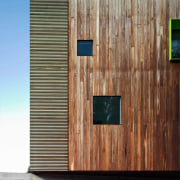 Interspaced windows break up the wood facade - architecture, building, facade, home, house, siding, wall, wood, wood stain