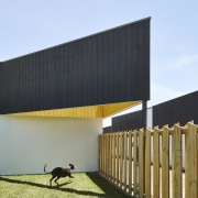 Plenty of room for frolicking underneath this roof architecture, building, facade, grass, house, sky, teal