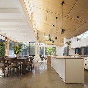 The home has a clear relationship with the architecture, ceiling, daylighting, floor, house, interior design, real estate, roof, table, white, brown