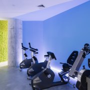 Elements such as the blue warming up zone gym, interior design, room, structure, blue