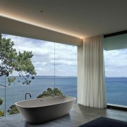 Bathroom views don't get much better than this architecture, ceiling, condominium, daylighting, home, house, interior design, property, real estate, window, gray, black