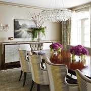 The formal dining room has a large chandelier chair, dining room, furniture, home, interior design, living room, purple, room, table, white, brown