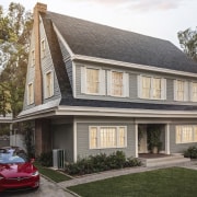 A home with Tesla Solar Roof tiles installed building, cottage, estate, facade, family car, home, house, property, real estate, residential area, roof, siding, suburb, window, gray, black