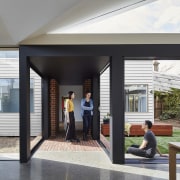 The tunnel opens up to the yard - architecture, door, house, interior design, lobby, window, black, white, gray
