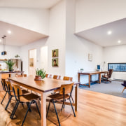 Kitchen, dining and office all share one space ceiling, dining room, floor, flooring, hardwood, interior design, living room, property, real estate, room, table, white