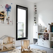 This nursery area is large, open and child-friendly furniture, home, interior design, living room, room, table, gray