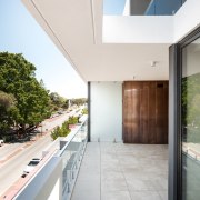 There's a view from the balustrade above to apartment, architecture, condominium, daylighting, estate, floor, home, house, interior design, property, real estate, window, white