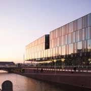Municipal Offices and Train Station, Delft - Municipal architecture, building, city, corporate headquarters, evening, facade, headquarters, metropolis, metropolitan area, mixed use, reflection, sky, structure, sunlight, water, waterway, white, black