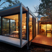 Floor to ceiling windows ring large parts of architecture, home, house, property, real estate, roof, window, black