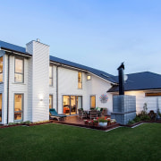 Two-story home clad with Envira bevel back weatherboards cottage, elevation, estate, facade, farmhouse, home, house, property, real estate, residential area, roof, siding, window, teal