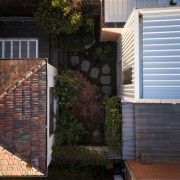 Another view of the courtyard - Another view backyard, brick, brickwork, facade, home, house, outdoor structure, property, real estate, residential area, roof, siding, wall, window, black