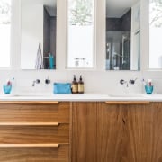 A wood vanity adds an element of colour bathroom, bathroom accessory, bathroom cabinet, cabinetry, countertop, interior design, kitchen, product design, room, sink, white