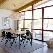 A view of the dining room, with large architecture, ceiling, chair, daylighting, dining room, floor, furniture, home, house, interior design, living room, property, real estate, room, table, window, white, gray