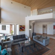 The landing on the first floor overlooks the ceiling, estate, house, interior design, living room, property, real estate, room, gray