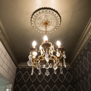 Chandelier and patterned wallpaper in powder room designed ceiling, chandelier, decor, light, light fixture, lighting, wall, black, brown