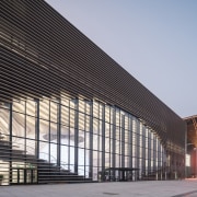 The Tianjin Binhai Library includes an eye-like aperture architecture, building, commercial building, convention center, corporate headquarters, daylighting, facade, headquarters, infrastructure, line, metropolis, metropolitan area, mixed use, sky, structure, gray, black