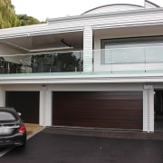 Read the story on the HomePlus website automotive exterior, building, car, door, facade, family car, garage, home, house, luxury vehicle, property, real estate, vehicle, black, white