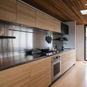An integrated extraction unit and a  large stainless cabinetry, countertop, cuisine classique, interior design, kitchen, real estate, brown