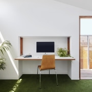 This office area sits tucked into the wall architecture, desk, furniture, house, interior design, office, real estate, table, window, white