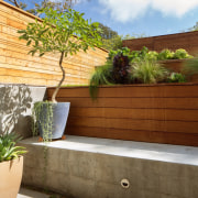 The terraced garden is a unique solution to architecture, backyard, estate, home, house, landscape, outdoor structure, plant, property, real estate, tree, wall, brown