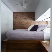 Light from the lounge illuminates the bedroom. There's architecture, bed, bed frame, bedroom, ceiling, daylighting, floor, furniture, home, interior design, room, wall, wood, wood flooring, gray