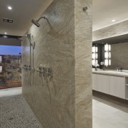 No shortage of shower options in this bathroom architecture, ceiling, countertop, floor, flooring, interior design, lobby, real estate, tile, wall, gray