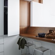 A small office/storage area sits next to the architecture, floor, furniture, interior design, product design, table, wall, gray, white