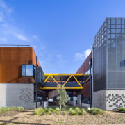 Stepping back, you can see more yellow elements architecture, building, facade, home, house, real estate, teal