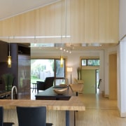 A skylight in the kitchen lights the island architecture, ceiling, house, interior design, kitchen, real estate, gray