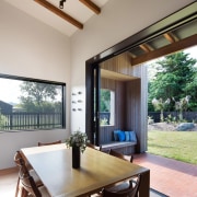 The dining area opens up to the back estate, house, interior design, property, real estate, window, gray