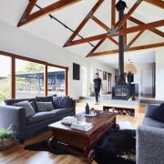 Exposed beams harken back to the home's past beam, ceiling, daylighting, floor, hardwood, home, house, interior design, living room, loft, room, wood, white