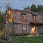 The contemporary additions manage to blend seamlessly with barn, building, cottage, estate, facade, farmhouse, home, house, log cabin, property, real estate, shed, siding