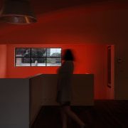 The red sign certainly stands out, even when architecture, ceiling, darkness, daylighting, furniture, house, interior design, lamp, light, light fixture, lighting, orange, product design, table, wall, red, black