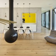 Inside, everything is centred around the views - architecture, chair, floor, flooring, furniture, hardwood, house, interior design, laminate flooring, living room, loft, product design, structure, table, wood flooring, gray
