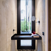 In the powder room, a custom sink made 