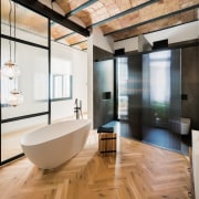 Herringbone floor, traditional tile ceiling and textured glass 